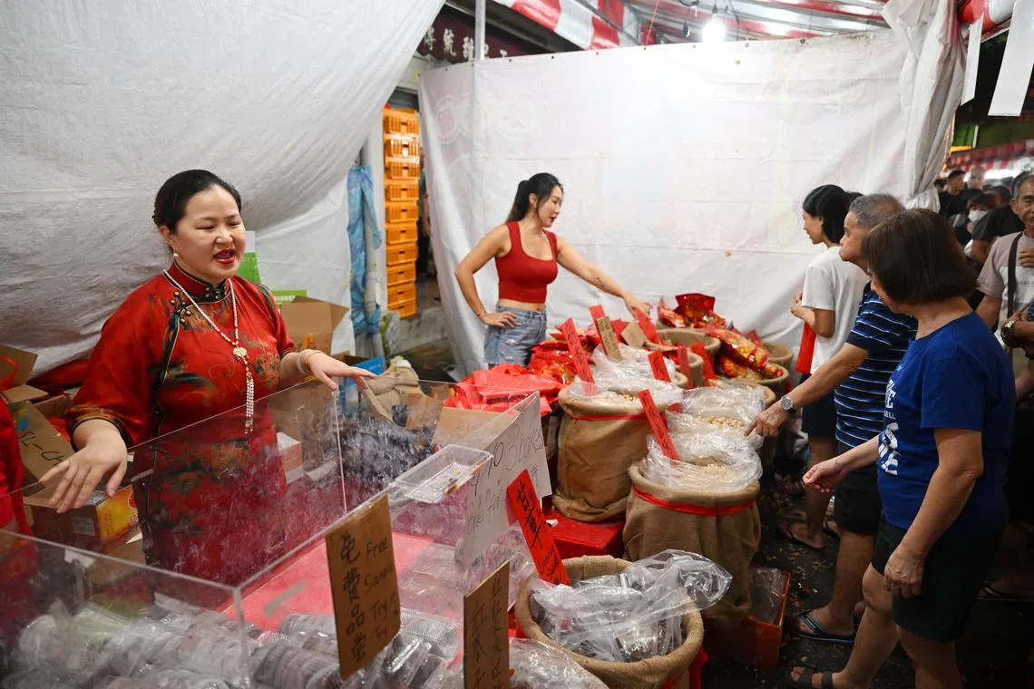 People at the Chinese New Year Bazaar in Chinatown were there to soak in the festive atmosphere and to complete their last-minute shopping on the eve of Chinese New Year on Feb 9.