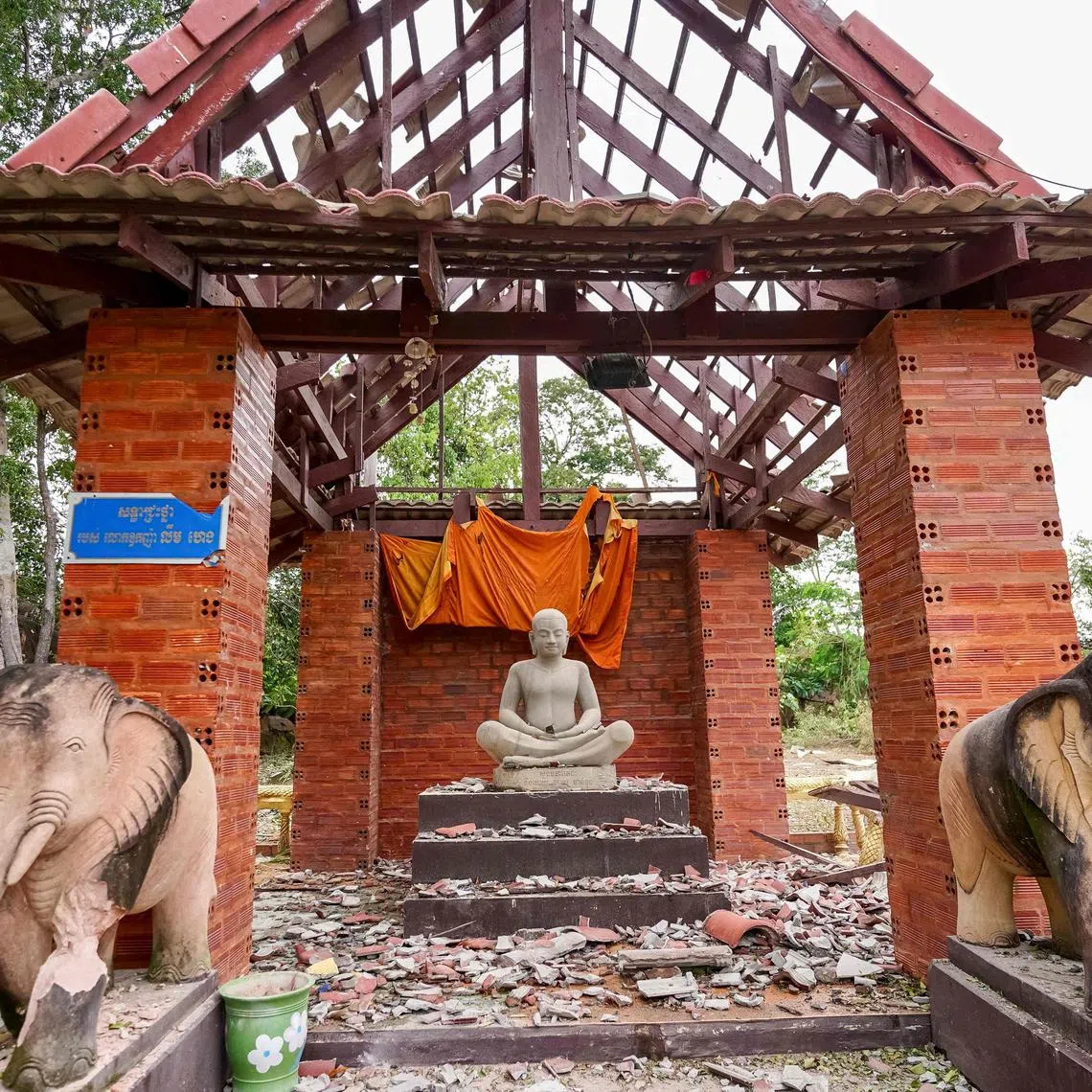 A pagoda damaged by Thai artillery is pictured in Oddar Meanchey province on July 25, 2025. Thailand's acting Prime Minister Phumtham Wechayachai warned on July 25 that cross-border clashes with Cambodia that have uprooted more than 130,000 people "could develop into war", as the countries traded deadly strikes for a second day. (Photo by AFP)