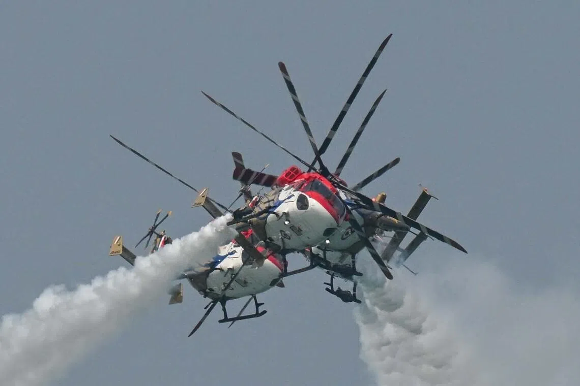 The Indian Air Force's Sarang Helicopter Display Team  during the aerial display on the second public day of Singapore Airshow 2026 at Changi Exhibition Centre on Feb 8, 2026. 