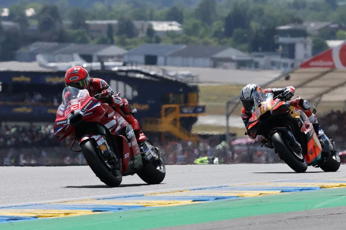 FILE PHOTO: MotoGP - French Grand Prix - Bugatti Circuit, Le Mans, France  - May 9, 2026 Ducati Lenovo Team's Marc Marquez and Red Bull KTM Factory Racing's Pedro Acosta in action during the sprint race REUTERS/Stephane Mahe/File Photo