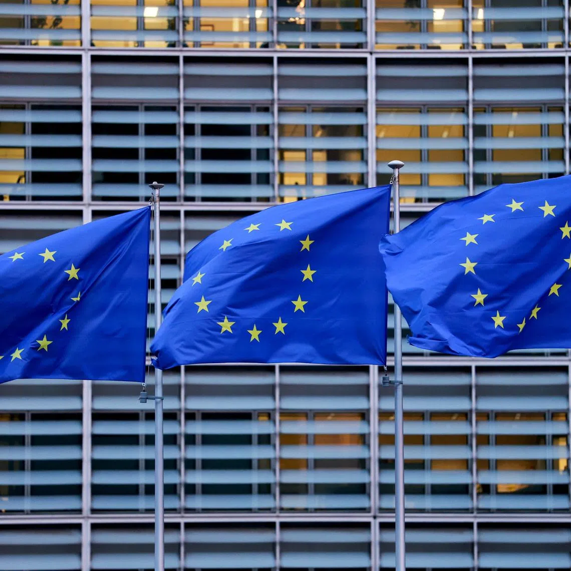 European Union flags flutter outside the EU Commission headquarters, on the day of a European Union leaders' summit in Brussels, Belgium, December 18, 2025. REUTERS/Stephanie Lecocq