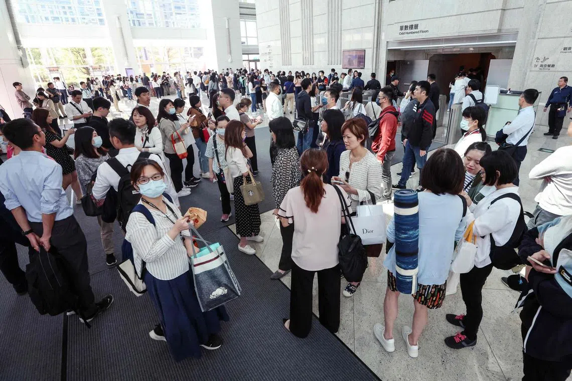 People gathering in the lobby of the Taipei 101 office building in Taipei, following a major earthquake in eastern Taiwan on April 3, 2024.