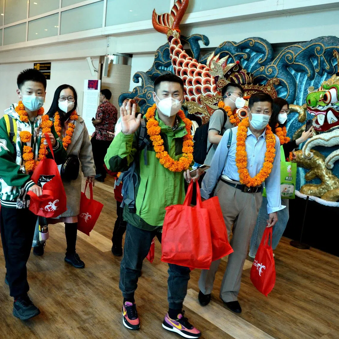 FILE PHOTO: First batch of Chinese tourists arrived at Ngurah Rai InternationalÊAirport following the Chinese Government's resumption of travel for citizens in Bali, Indonesia, January 22, 2023 Antara Foto/Fikri Yusuf/via REUTERS ATTENTION EDITORS - THIS IMAGE HAS BEEN SUPPLIED BY A THIRD PARTY. MANDATORY CREDIT. INDONESIA OUT. NO COMMERCIAL OR EDITORIAL SALES IN INDONESIA./File Photo