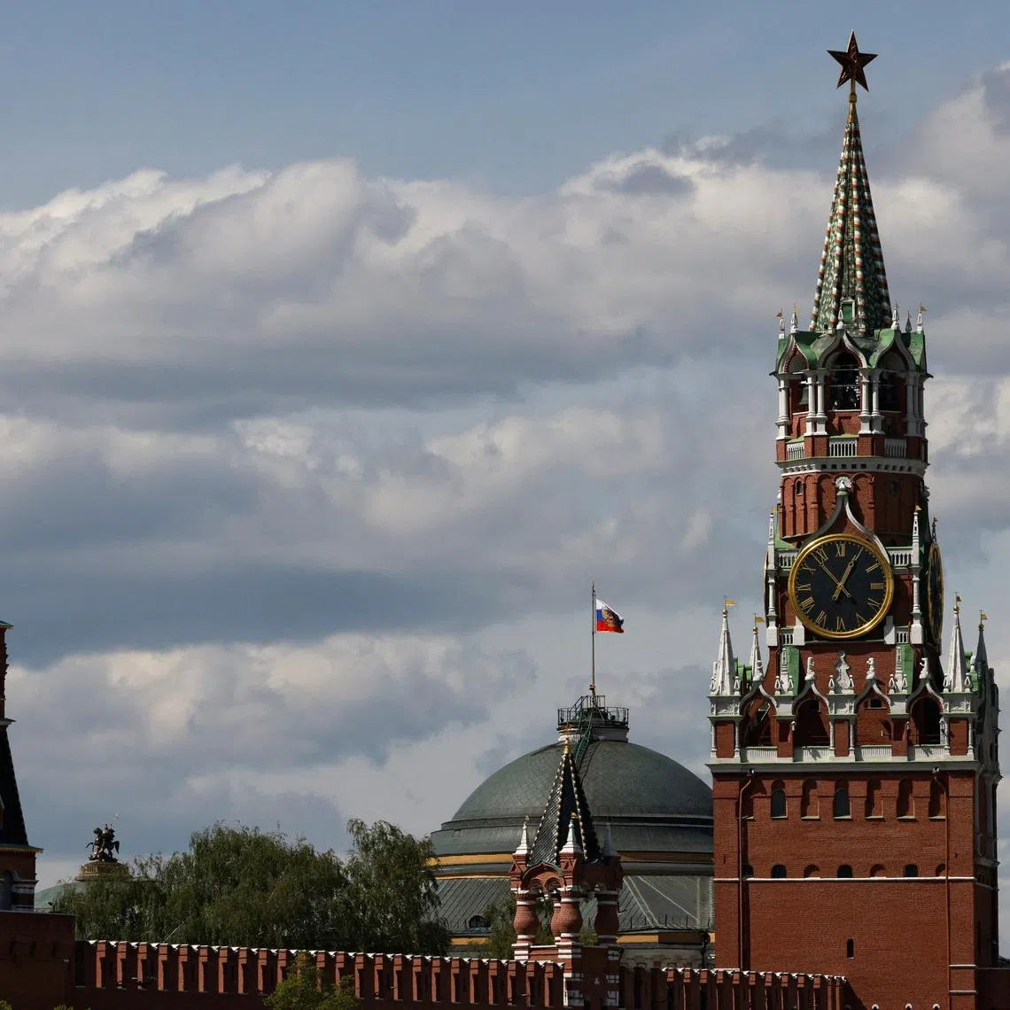 The Russian flag flies on the dome of the Kremlin Senate building behind Spasskaya Tower, in central Moscow, Russia, May 4, 2023. REUTERS/Stringer