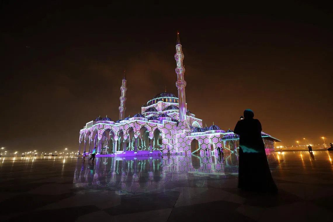 The Sharjah Mosque is lit up in a colourful display for the 11th annual Sharjah Light Festival in the emirate of Sharjah on Feb 8, 2023..