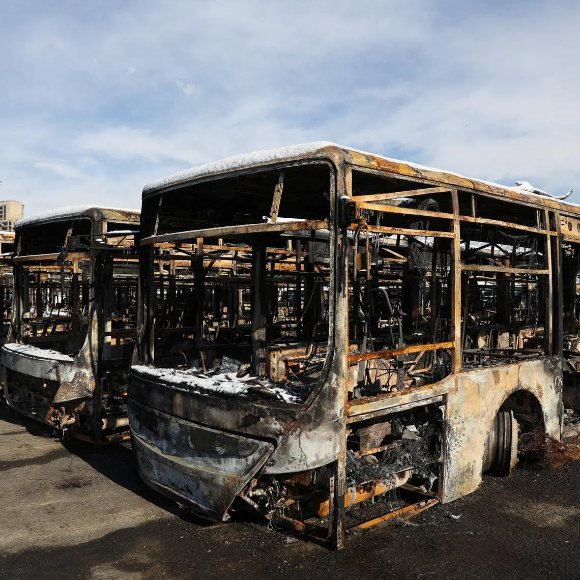 Buses that were burned during recent protests in Tehran.