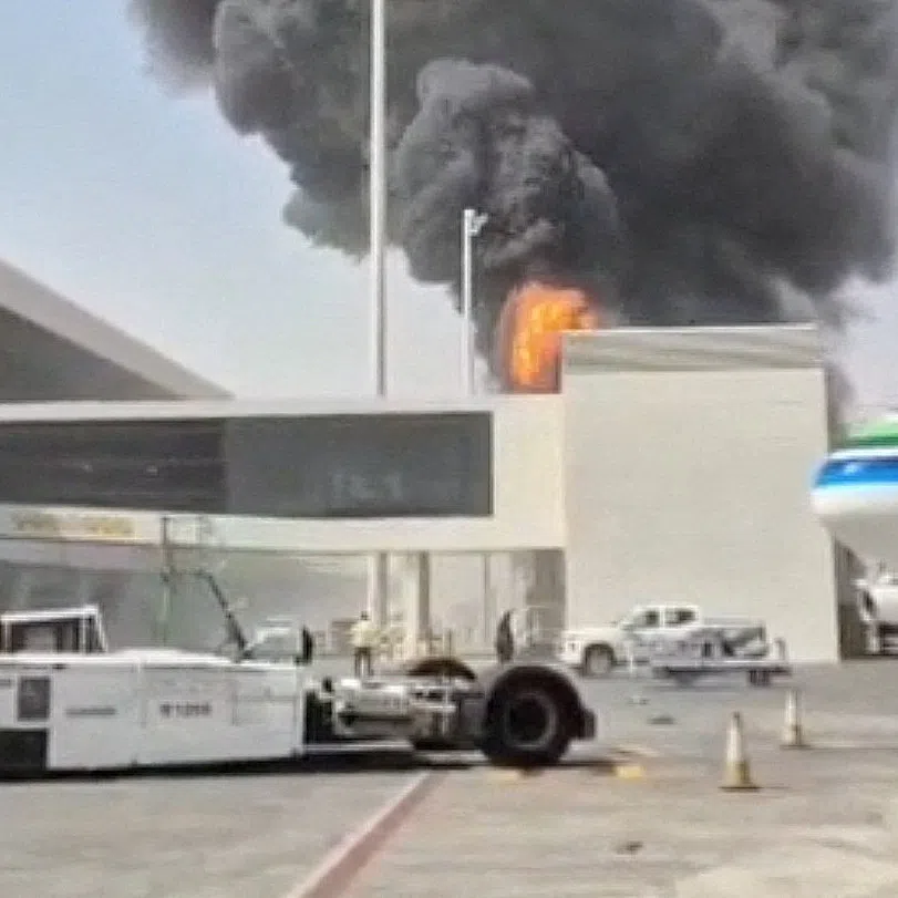 Smoke and flames rise from King Khalid Airport, after Yemen’s Iran-backed Houthis said they attacked the airport, in Riyadh, Saudi Arabia, on Oct 8.