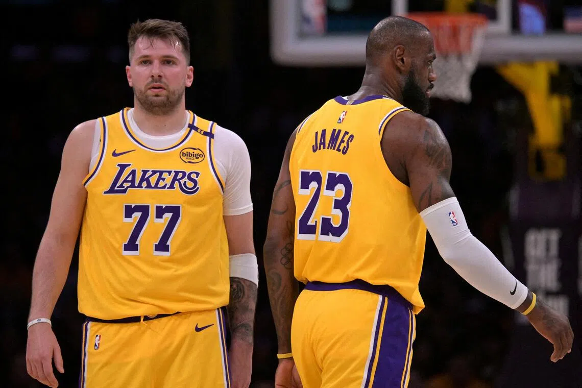 Los Angeles Lakers guard Luka Doncic (No. 77) and forward LeBron James on the court in the first half against the Utah Jazz at Crypto.com Arena. 