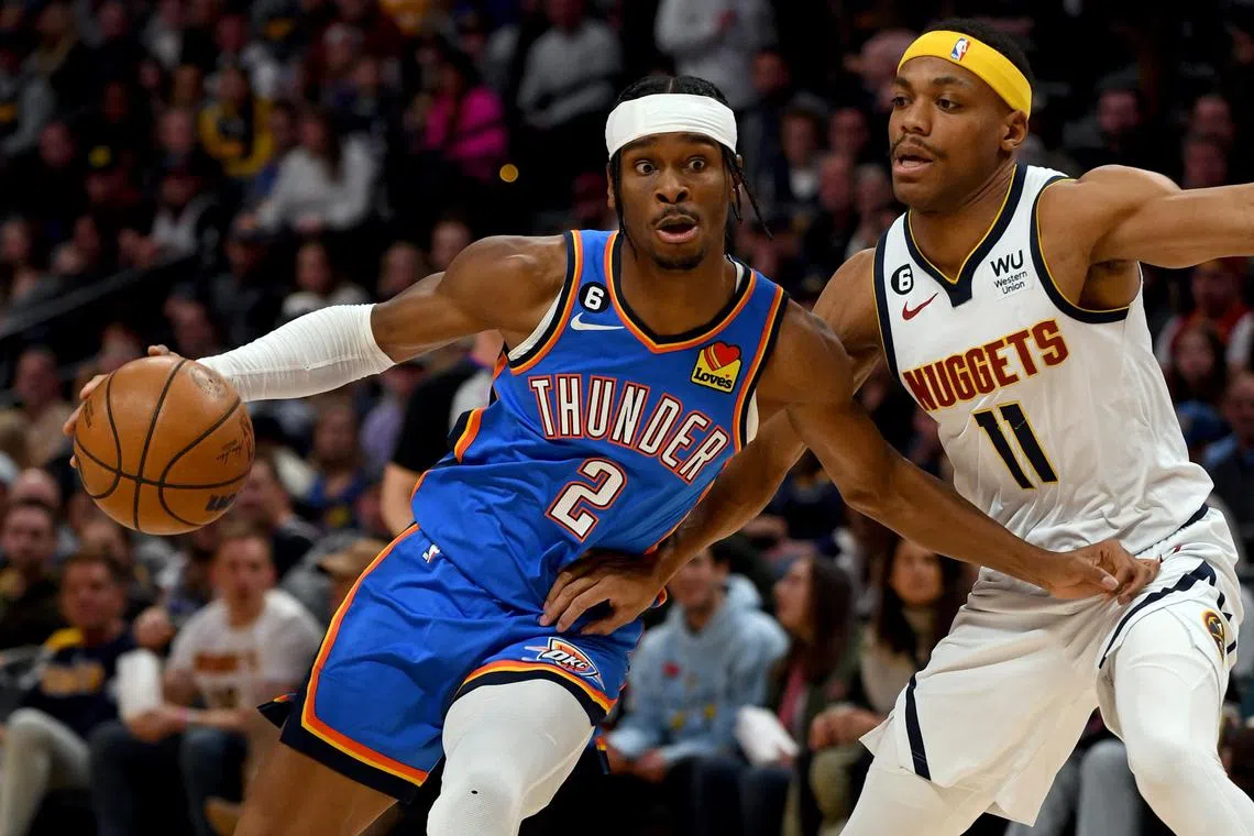 Oklahoma City Thunder guard Shai Gilgeous-Alexander (2) drives on Denver Nuggets forward Bruce Brown (11).