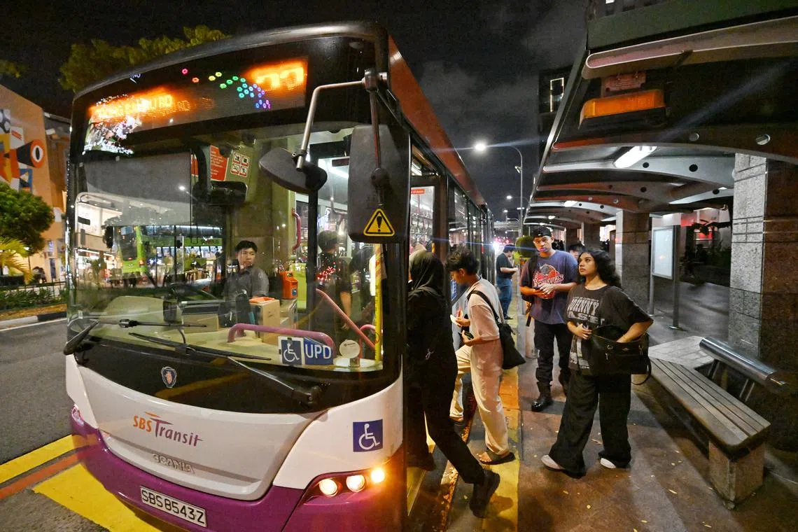 People boarding a bus along Victoria Street on July 30, 2024.