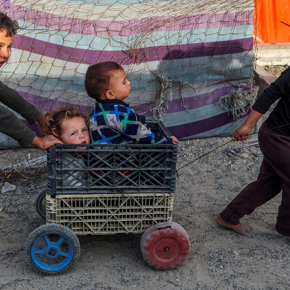 Palestinian children play at a tent camp in Khan Younis, Gaza, on May 9. At the end of 2025, 82.2 million people were living in internal displacement worldwide.