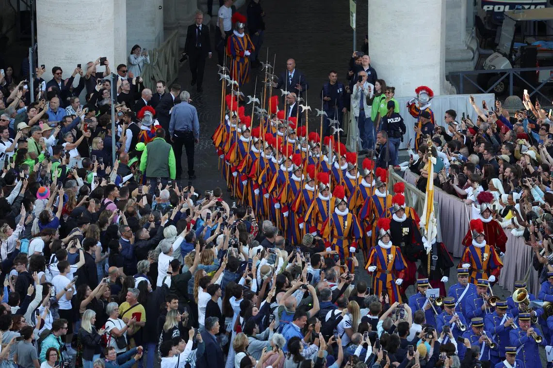 Swiss Guards marching into St. Peter's Square after white smoke rose from the chimney of the Sistine Chapel, signaling the election of a new pope at the Vatican on May 8.
 