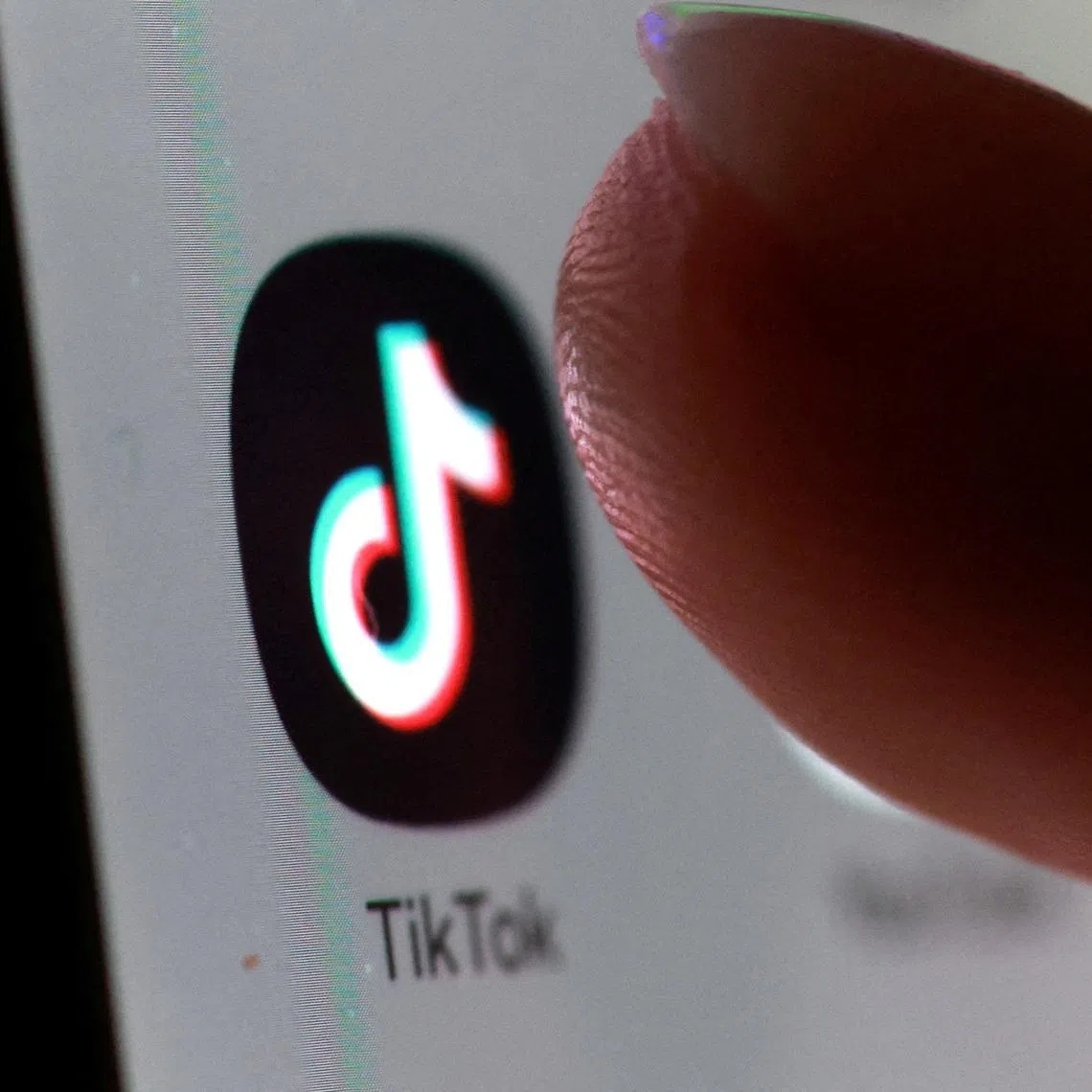 FILE PHOTO: The TikTok app icon on a smartphone in this illustration taken October 27, 2025. REUTERS/Dado Ruvic/Illustration/File Photo