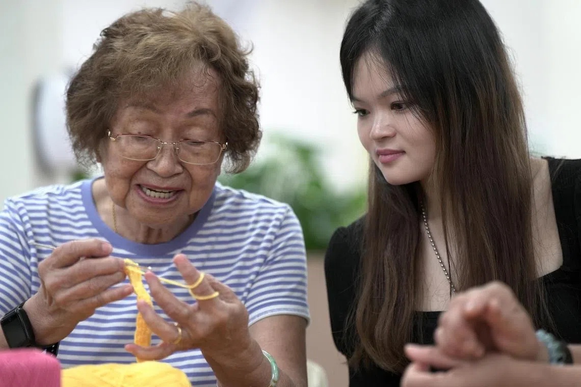 smaic16 - Third-year NUS business undergraduate Bridget Ho (right) with Madam Mary Hoon (left), 83, at NTUC Health Active Ageing Centre on Thursday. 



Credit: AIC