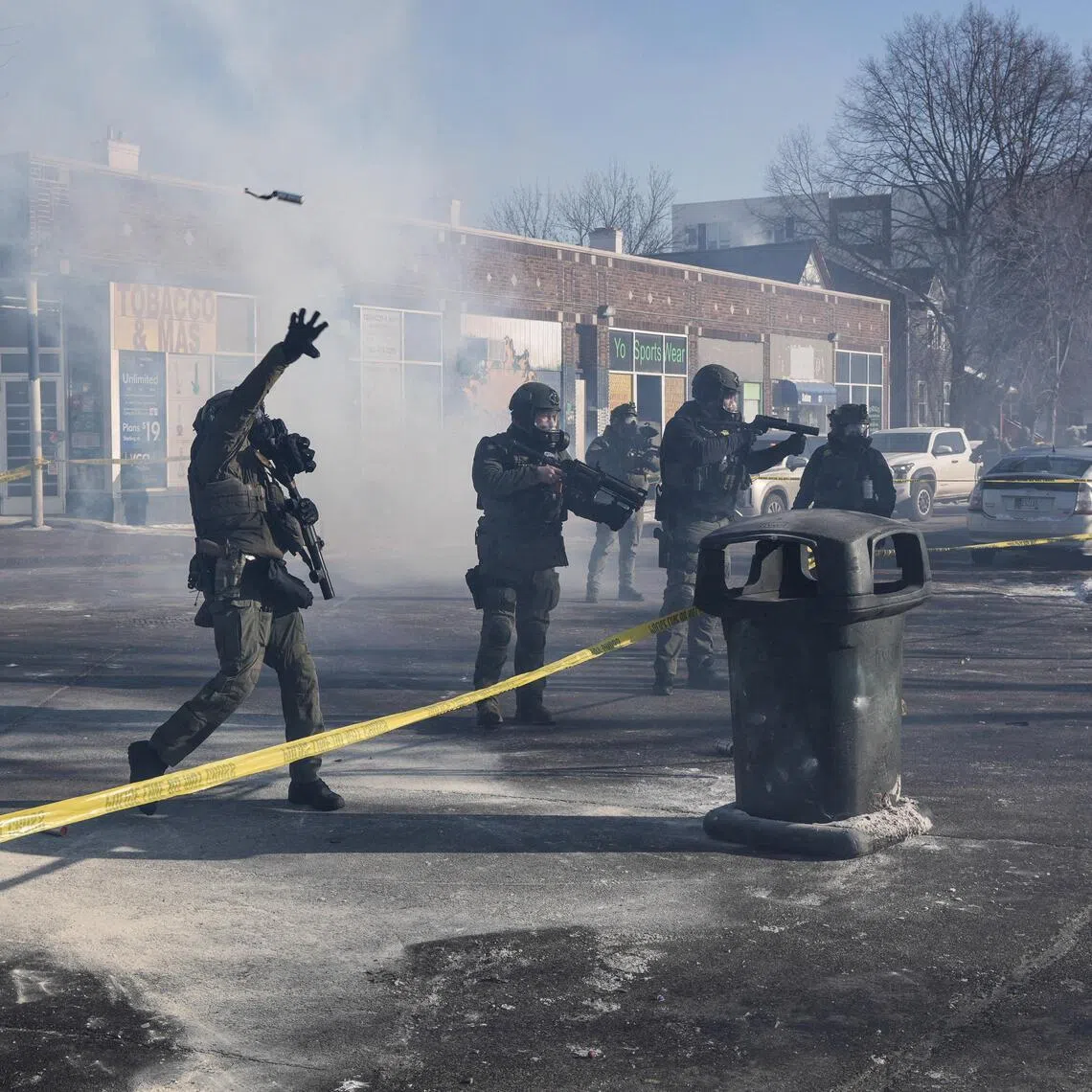 Federal agents during scuffles at the scene of a shooting involving federal immigration agents in Minneapolis, Minnesota, on Jan 24.