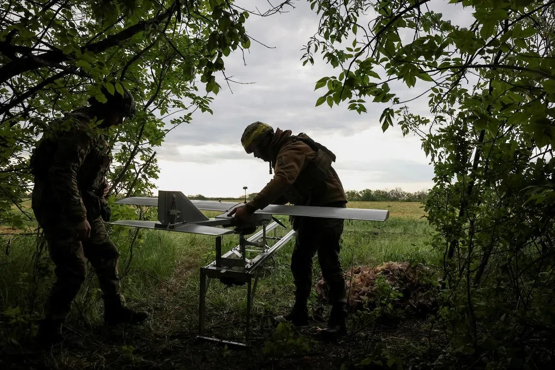 FILE PHOTO: An servicemen of the 15th Operative Purpose Brigade Kara-Dag, of the National Guard of Ukraine, prepare a Darts strike drone for flight over positions of Russian troops, amid Russia's attack on Ukraine, near Kupiansk, Kharkiv region, Ukraine May 11, 2025. Radio Free Europe/Radio Liberty/Serhii Nuzhnenko via REUTERS/File Photo