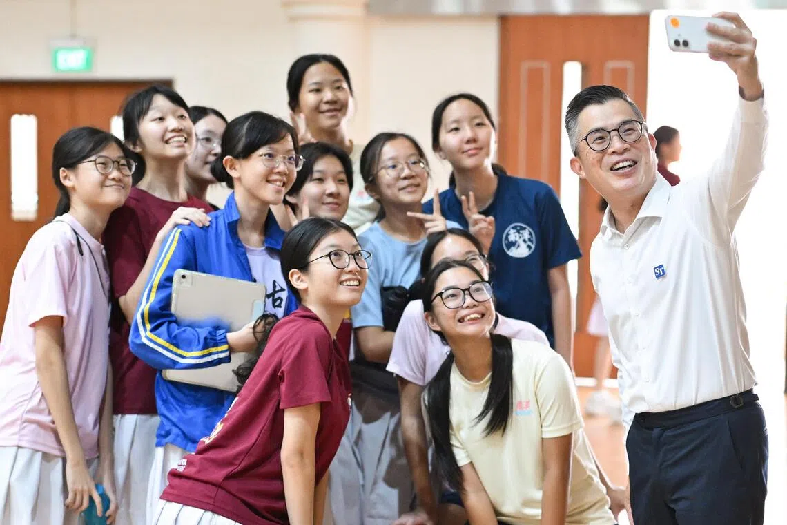 ST editor Jaime Ho with students at Nanyang Girls’ High School during a What’s The News? assembly programme on Aug 26.