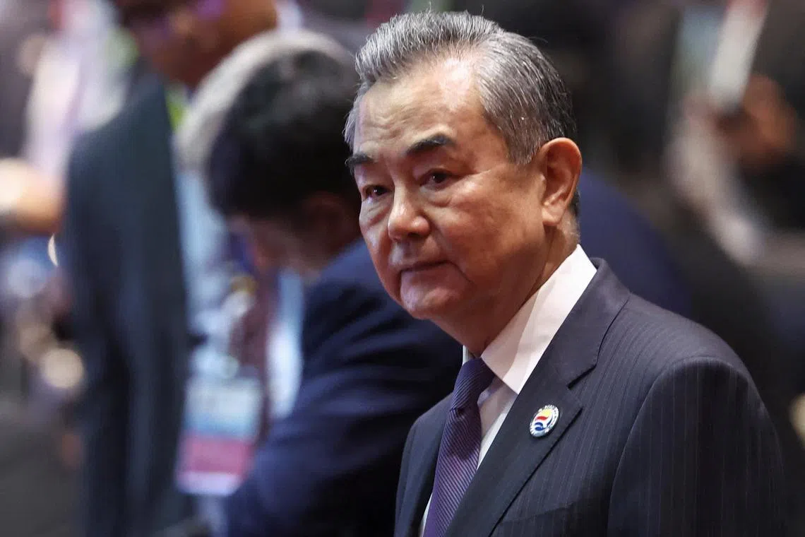 FILE PHOTO: China's Foreign Minister Wang Yi attends the 14th EAST Asia Summit Foreign Ministers' Meeting in the 57th ASEAN Foreign Ministers' Meeting at the National Convention Center, in Vientiane, Laos July 27, 2024. REUTERS/Chalinee Thirasupa/File Photo