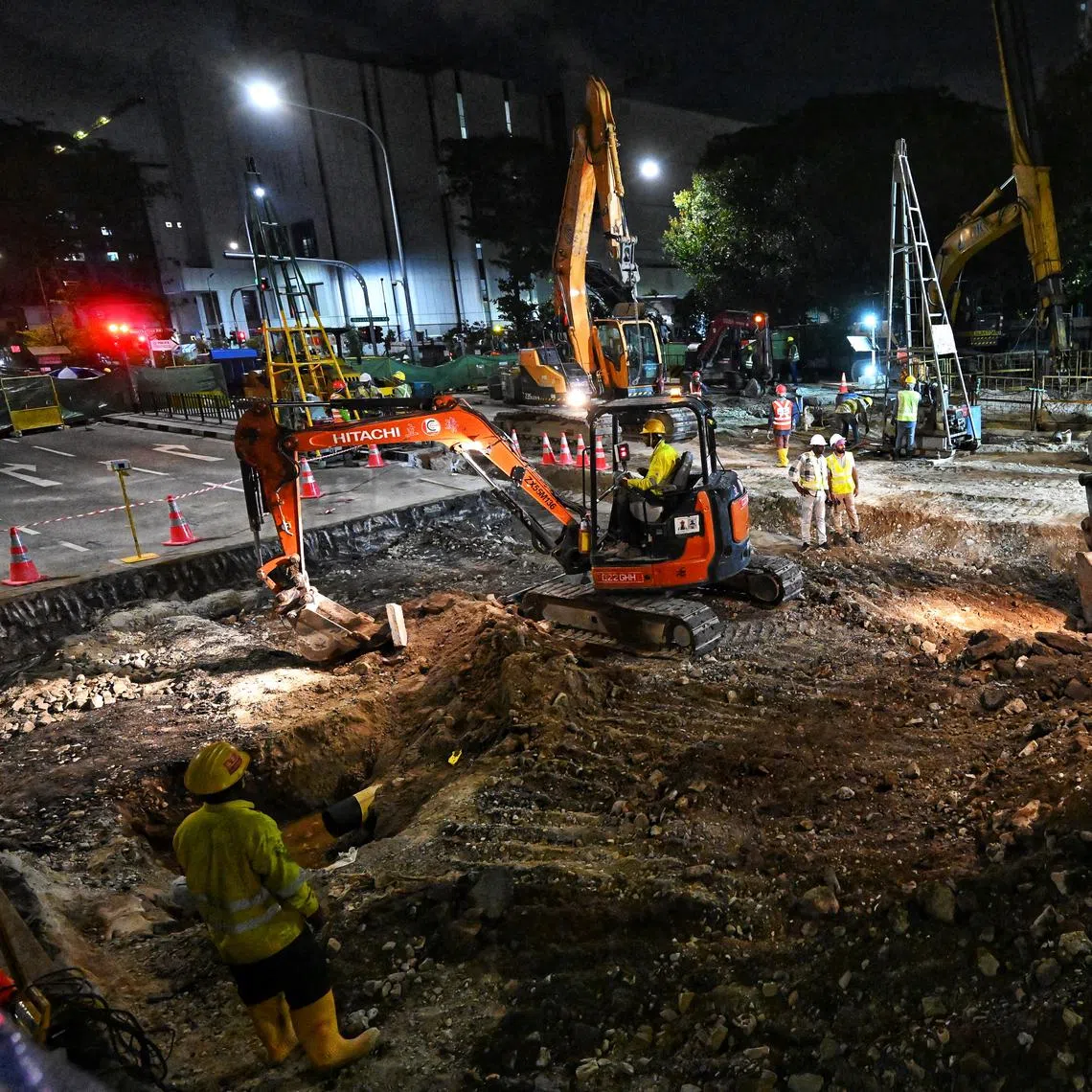 Repair works on the sinkhole under way at about 9.45pm on July 28.