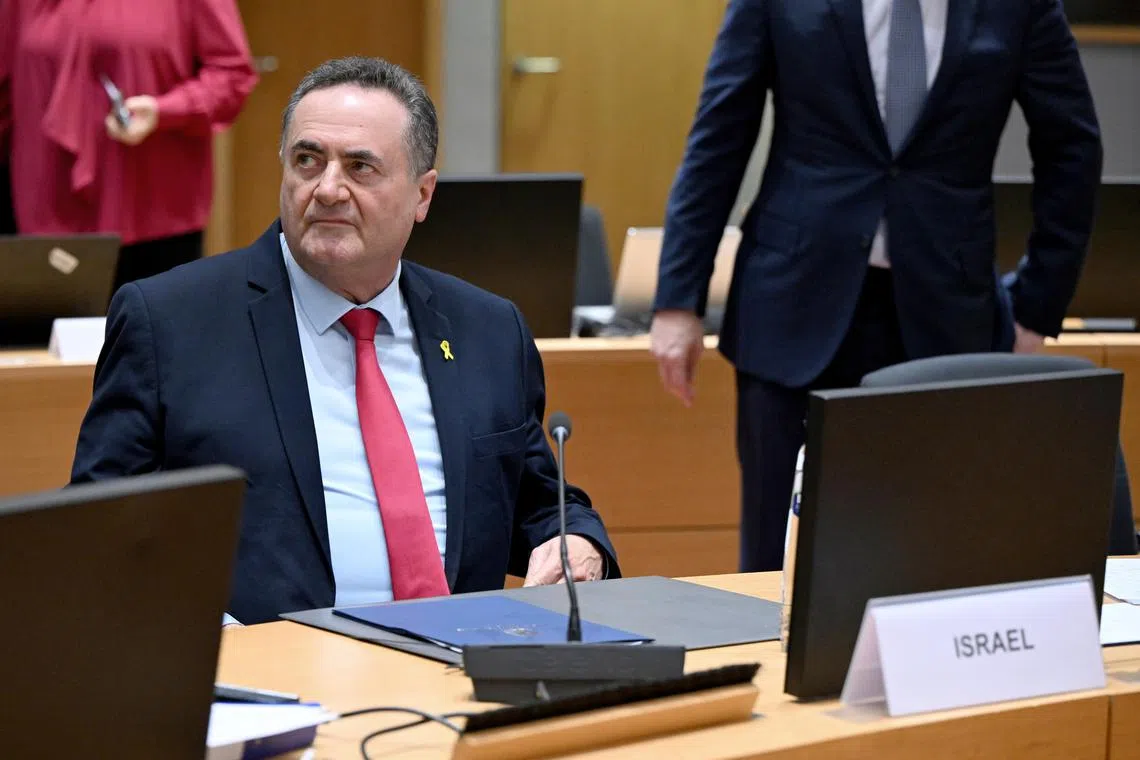 Israel's Foreign Minister Israel Katz (left) showed EU ministers aspirational videos of future infrastructure projects.