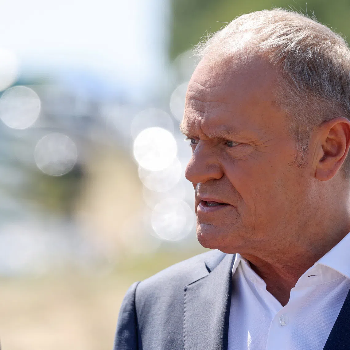Polish Prime Minister Donald Tusk speaks to the media, near the site where an unidentified flying object, believed to be a Russian missile, as Tusk said on Thursday, fell after violating Polish airspace in a field near the village of Tarnawa Kolonia, near Lublin, Poland, July 30, 2026. REUTERS/Kuba Stezycki/File Photo