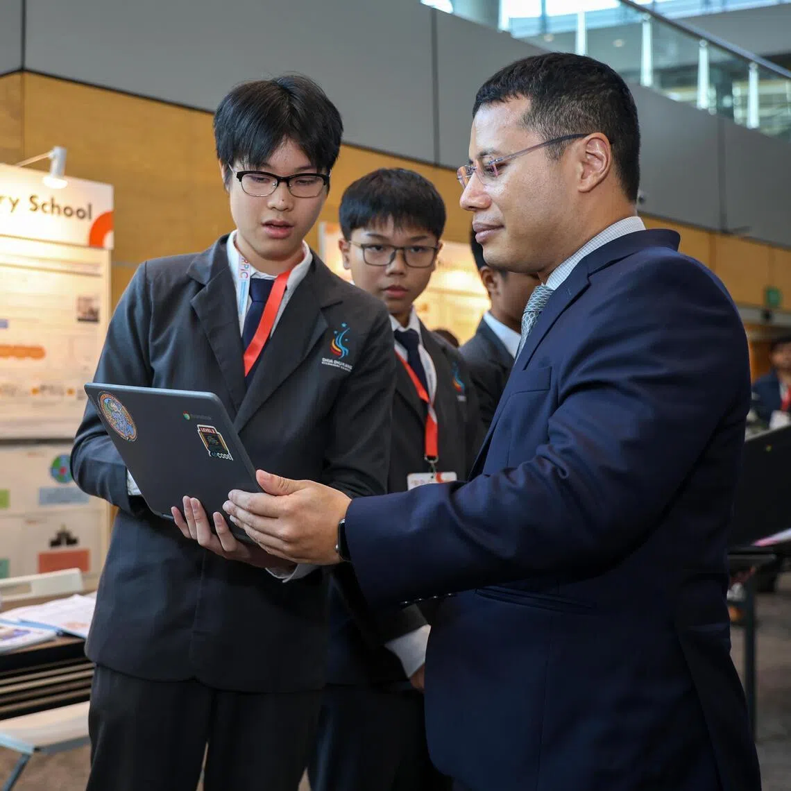 Minister for Education Desmond Lee speaks to Ow Jun Yi Gil, 15, a Secondary Three student from Choa Chu Kang Secondary School on June 2.
