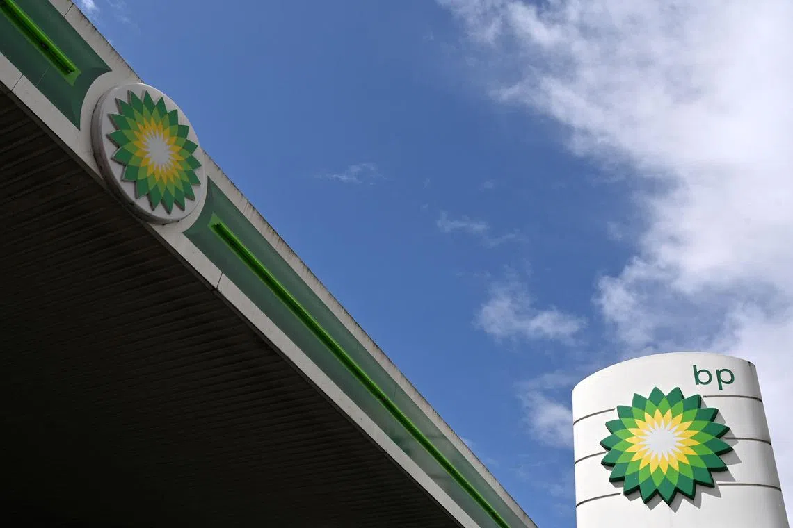 BP logos are pictured at a BP petrol and diesel filling station in north London. - British energy giant BP on February 7, 2023 announced a record profit for 2022 thanks to soaring oil and gas prices, as it watered down its target for cutting carbon emissions. BP's underlying profit more than doubled to a record $27.7 billion last year. (Photo by Glyn KIRK / AFP)