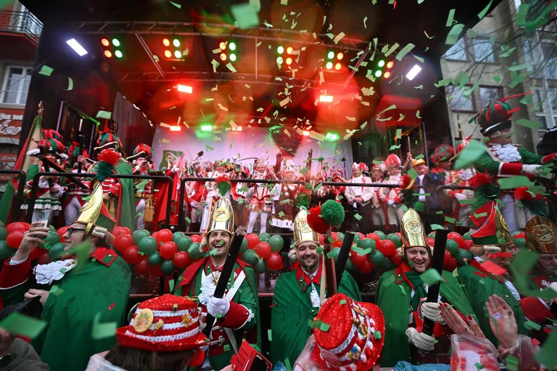 Carnival revellers celebrating "Weiberfastnacht" (Women's Carnival), marking the start of the street Carnival festivals in Cologne, Germany on Feb 12, 2026. 