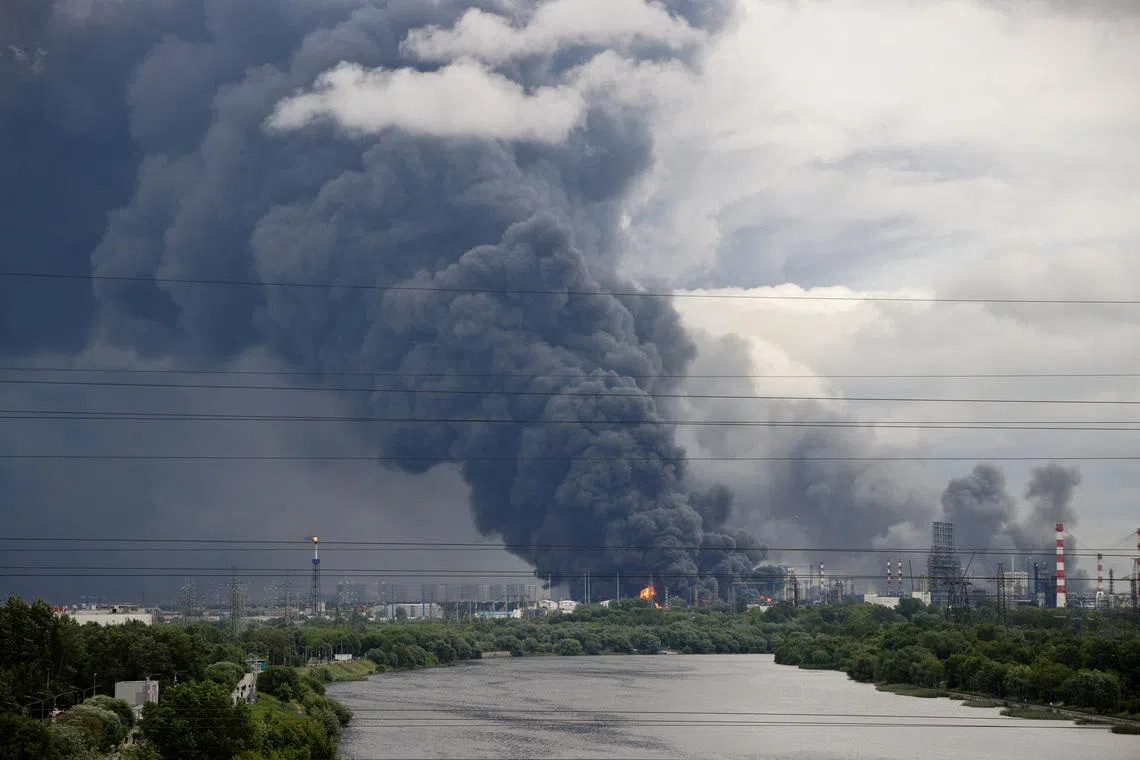 FILE PHOTO: Thick plumes of smoke with flames rise from an oil refinery following a Ukrainian drone attack in the course of Russia-Ukraine conflict, in Moscow, Russia, June 18, 2026, in this picture obtained from social media. SOCIAL MEDIA/via REUTERS/File Photo