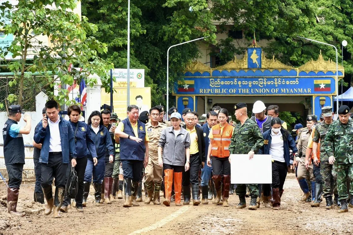 epa11601469 A handout photo made available by the Royal Thai Government shows Thai Prime Minister Paetongtarn Shinawatra (C) visiting a flooded area to monitor the flood situation in urban areas of Mae Sai District, in Chiang Rai Province, northern Thailand, 13 September 2024. At least nine people have died, several are missing, and more than 22,400 households have been affected by flash floods and landslides caused by the impact of Typhoon Yagi in several northern provinces of Thailand, according to the Department of Disaster Prevention and Mitigation of Thailand.  EPA-EFE/THE GOVERNMENT SPOKESMANS OFFICE / HANDOUT HANDOUT  HANDOUT EDITORIAL USE ONLY/NO SALES