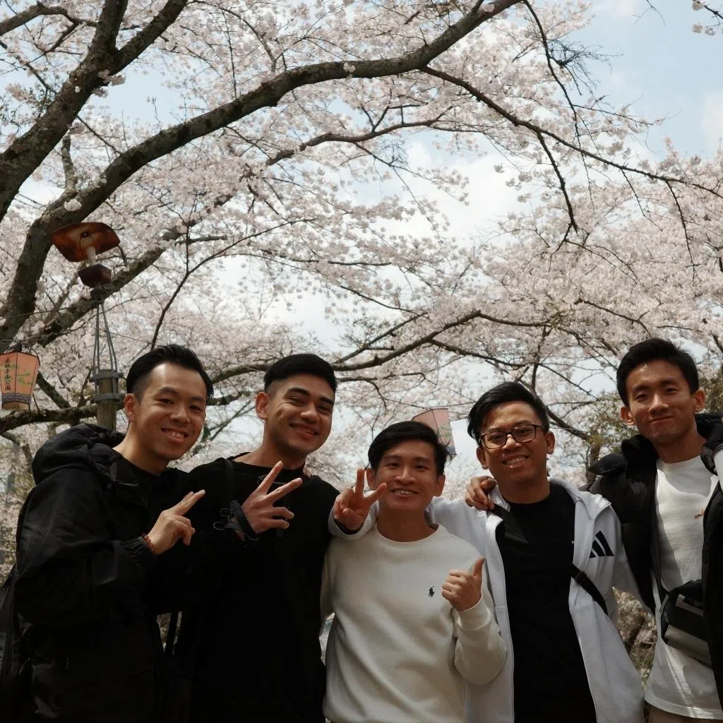 leroy lee (centre) manager and senior engineer at micron technology standing with colleagues during 18-month posting in hiroshima japan he went for three years after joining the company in 2021; micron ranked among best employers 2026 in singapore 