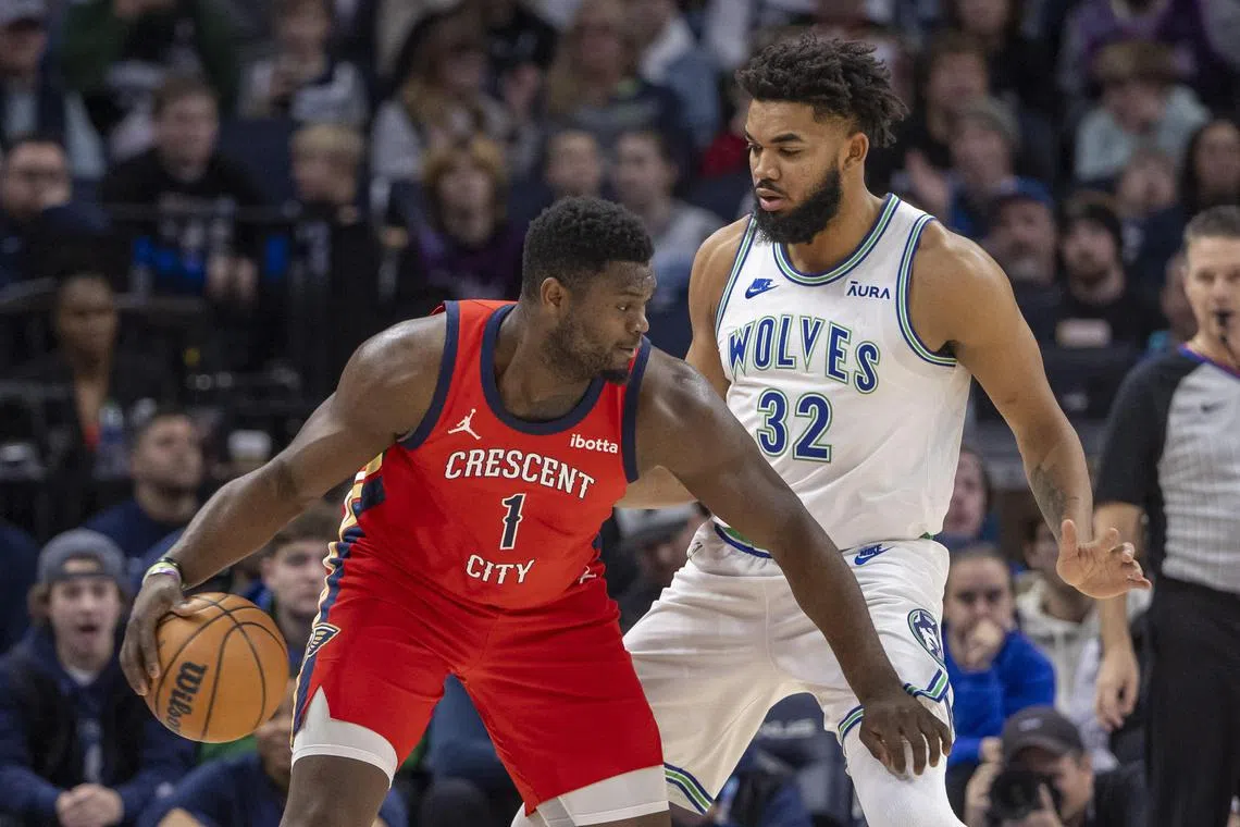 New Orleans Pelicans forward Zion Williamson shielding the ball against Minnesota Timberwolves centre Karl-Anthony Towns on Jan 3.