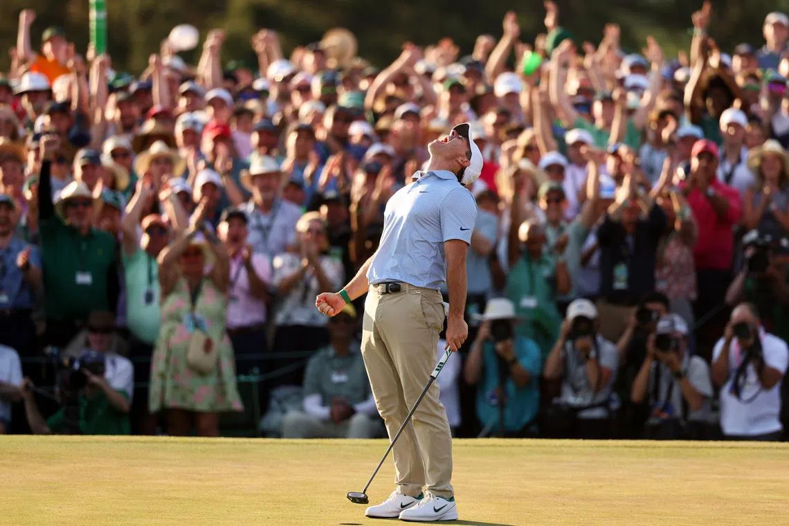 Apr 12, 2026; Augusta, Georgia, USA; Rory McIlroy reacts after making a putt to win the 2026 Masters Tournament at Augusta National Golf Club. Mandatory Credit: Bill Streicher-Imagn Images