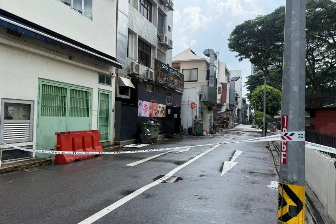 The alleyway behind the shophouse was also cordoned off.