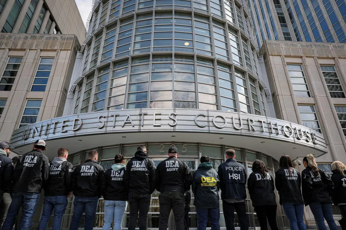 FILE PHOTO: Members of the Drug Enforcement Administration (DEA) stand on the day of a hearing for Guadalajara cartel founder Rafael Caro Quintero at the Brooklyn Federal Courthouse in Brooklyn, New York, U.S., March 26, 2025. REUTERS/Jeenah Moon/File Photo