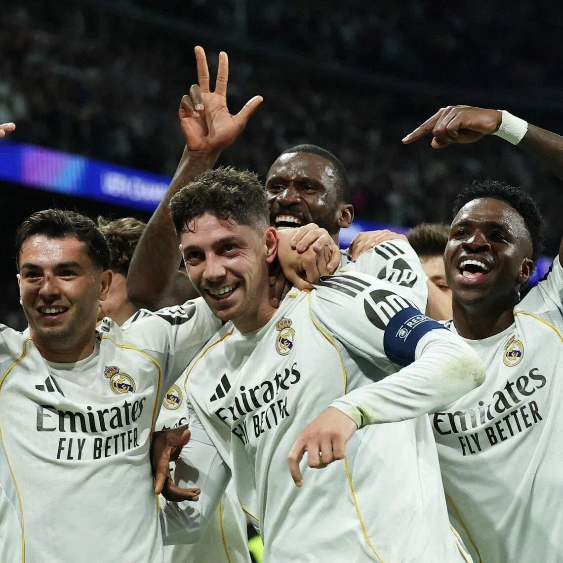 Real Madrid's Federico Valverde celebrates scoring their third goal with teammates.
