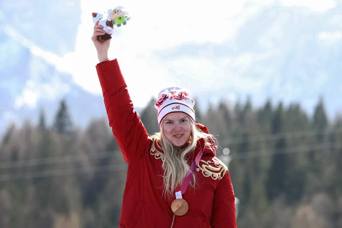 Paralympics-Russian flag returns to Games podium with two downhill bronzes