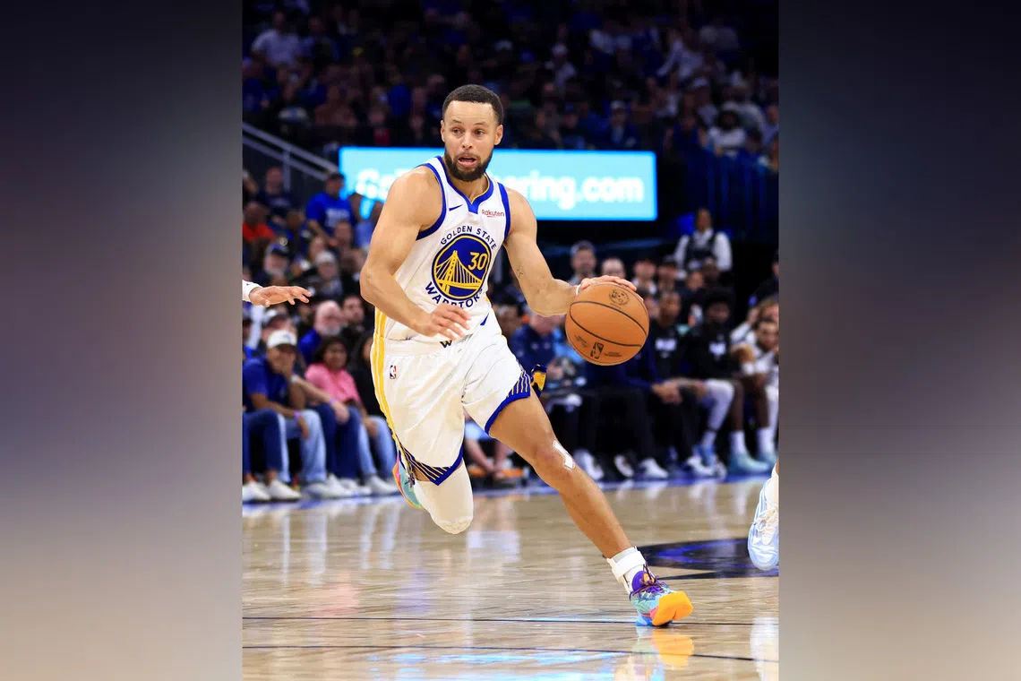 Stephen Curry of the Golden State Warriors drives to the basket in the second half during a game against the Orlando Magic.