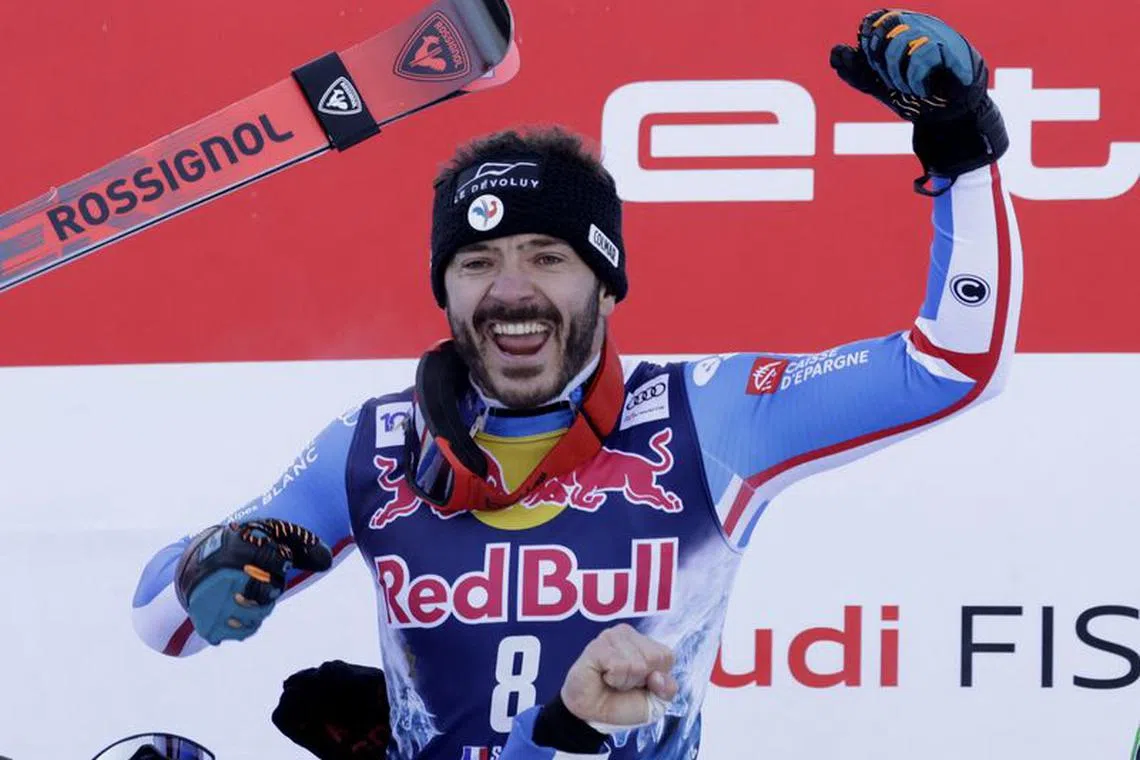Alpine Skiing - FIS Alpine Ski World Cup - Men's Downhill - Kitzbuehel, Austria - January 20, 2024 France's Cyprien Sarrazin celebrates on the podium after winning the Men's Downhill REUTERS/Leonhard Foeger