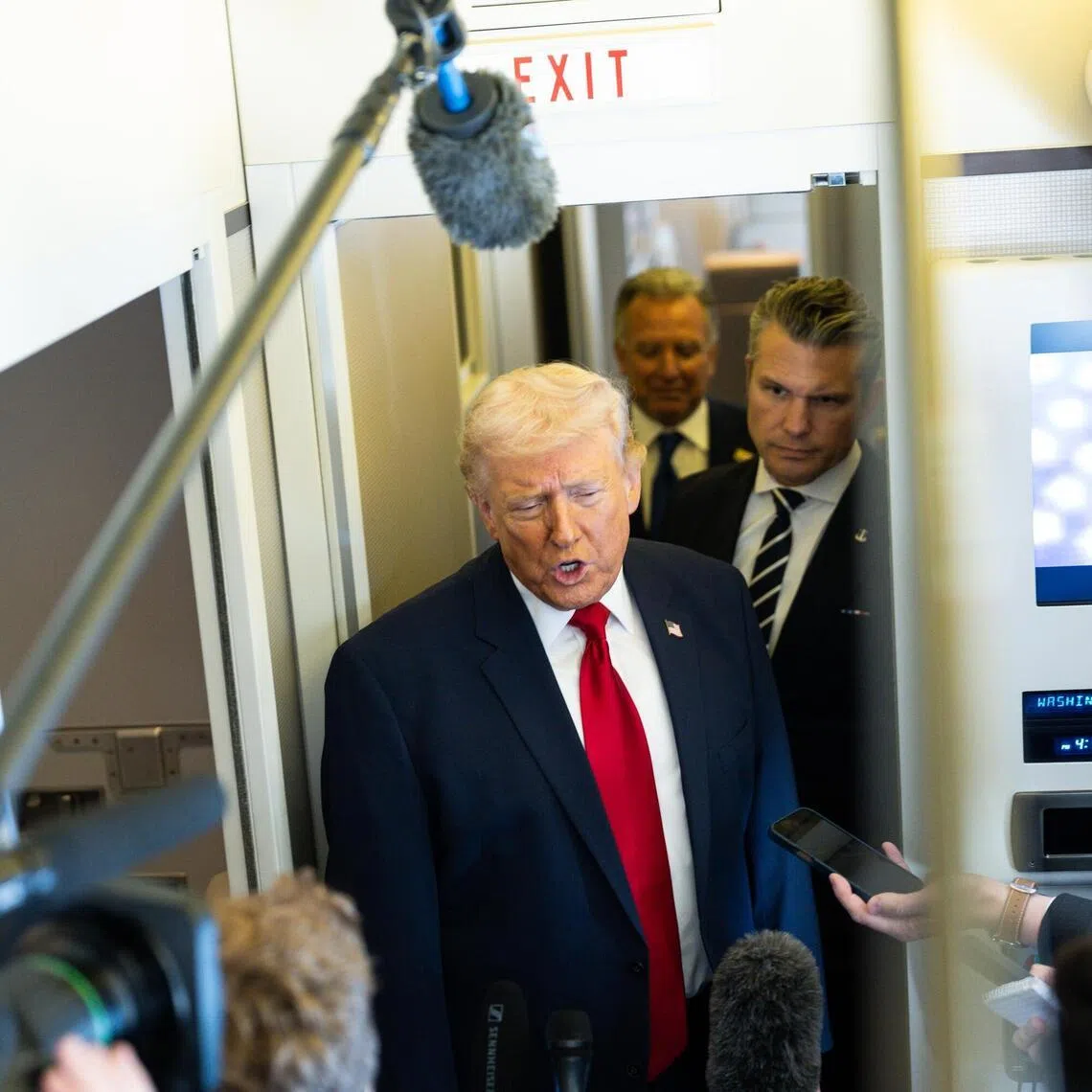 US President Donald Trump speaking to reporters aboard Air Force One on March 7.

