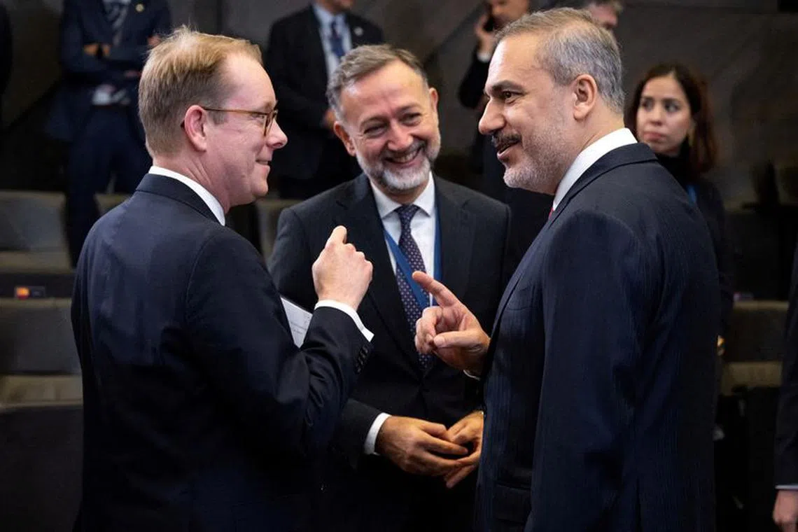 FILE PHOTO: Turkish Foreign Minister Hakan Fidan speaks with Swedish Foreign Minister Tobias Billstrom ahead of the NATO Foreign Ministers meeting at NATO Headquarters in Brussels, Belgium, November 28, 2023. SAUL LOEB/Pool via REUTERS/File Photo