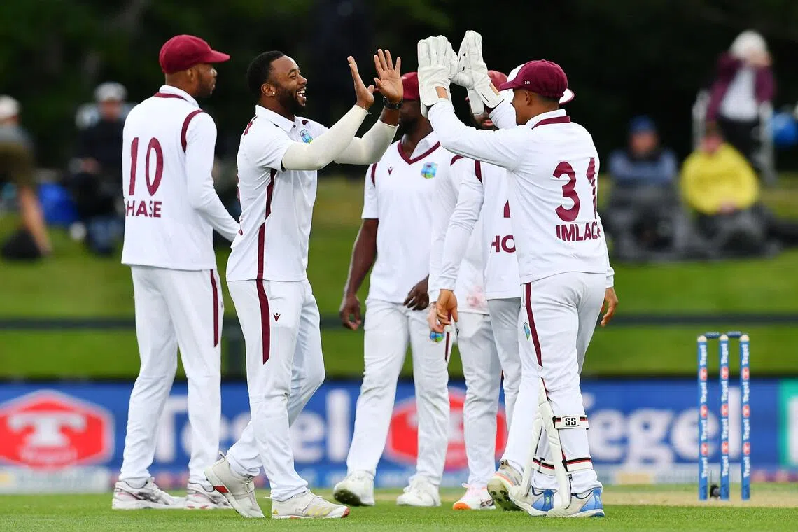 West Indies' Ojay Shields (second from left) celebrates the wicket of New Zealand's Michael Bracewell with his teammates on day one of the first cricket Test at Hagley Oval in Christchurch on Dec 2, 2025.