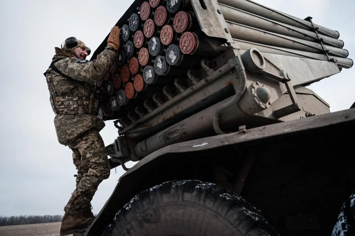 Ukrainian servicemen prepare to fire on Russian positions, near the Ukrainian city of Bakhmut.