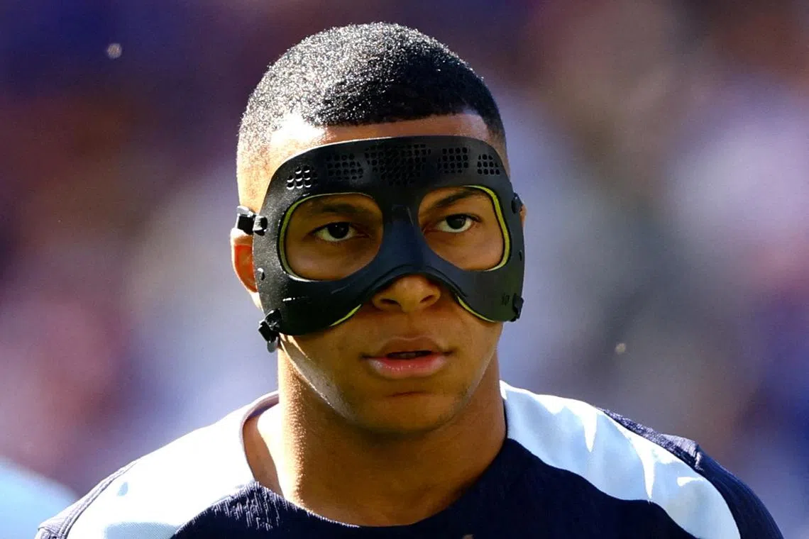 FILE PHOTO: Soccer Football - Euro 2024 - Group D - France v Poland - Dortmund BVB Stadion, Dortmund, Germany - June 25, 2024 France's Kylian Mbappe is pictured wearing a protective face mask during the warm up before the match REUTERS/Kacper Pempel/File Photo