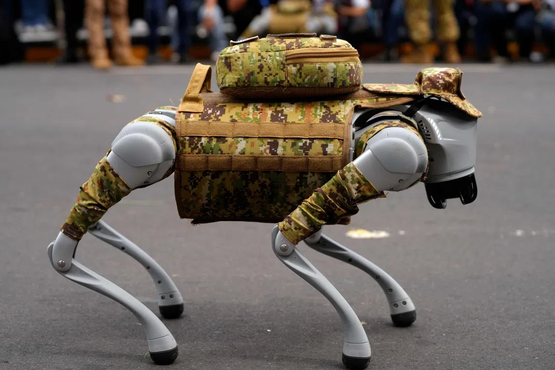 TOPSHOT - This handout image released by the El Salvador's Presidency Press Office shows a camouflage-clad robotic dog of the Salvadoran Armed Forces during a military parade marking the 205th anniversary of El Salvador's independence in San Salvador on September 15, 2026. (Photo by Handout / EL SALVADOR'S PRESIDENCY PRESS OFFICE / AFP) / RESTRICTED TO EDITORIAL USE - MANDATORY CREDIT "AFP PHOTO / EL SALVADOR'S PRESIDENCY PRESS OFFICE " - NO MARKETING NO ADVERTISING CAMPAIGNS - DISTRIBUTED AS A SERVICE TO CLIENTS