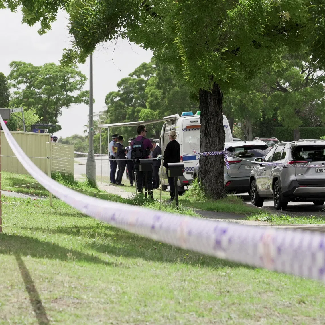 Police officers stand guard outside the house of the suspects of a shooting incident on a Jewish holiday celebration at Bondi Beach, in Bonnyrigg, Sydney, Australia, December 15, 2025. REUTERS/Alasdair Pal