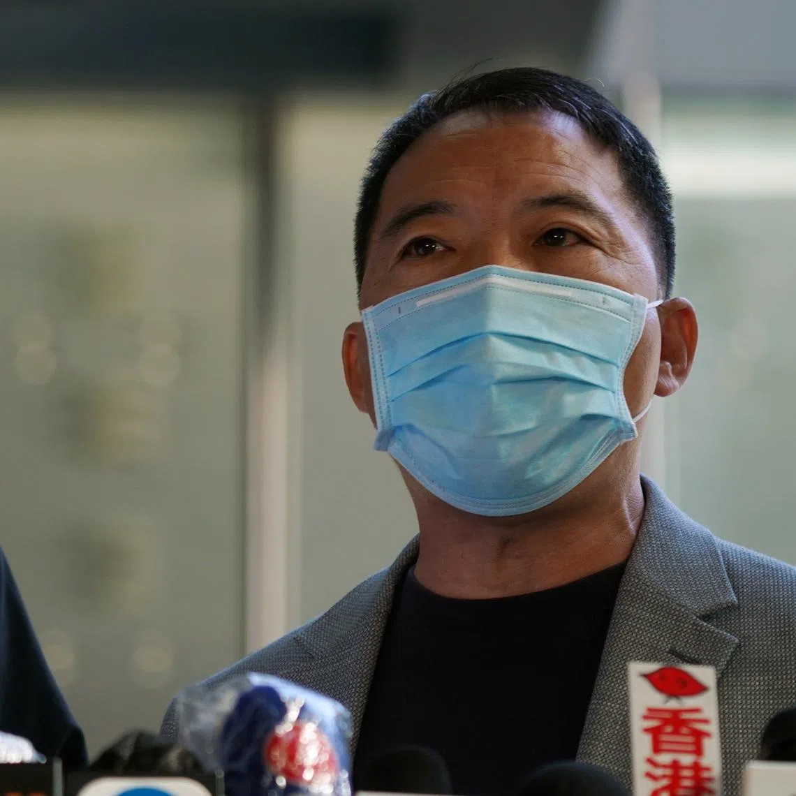 Wu Chi-Wai, a former leader of the now-defunct Democratic Party, was stopped when he arrived at Heathrow Airport and told he could only stay for a week.