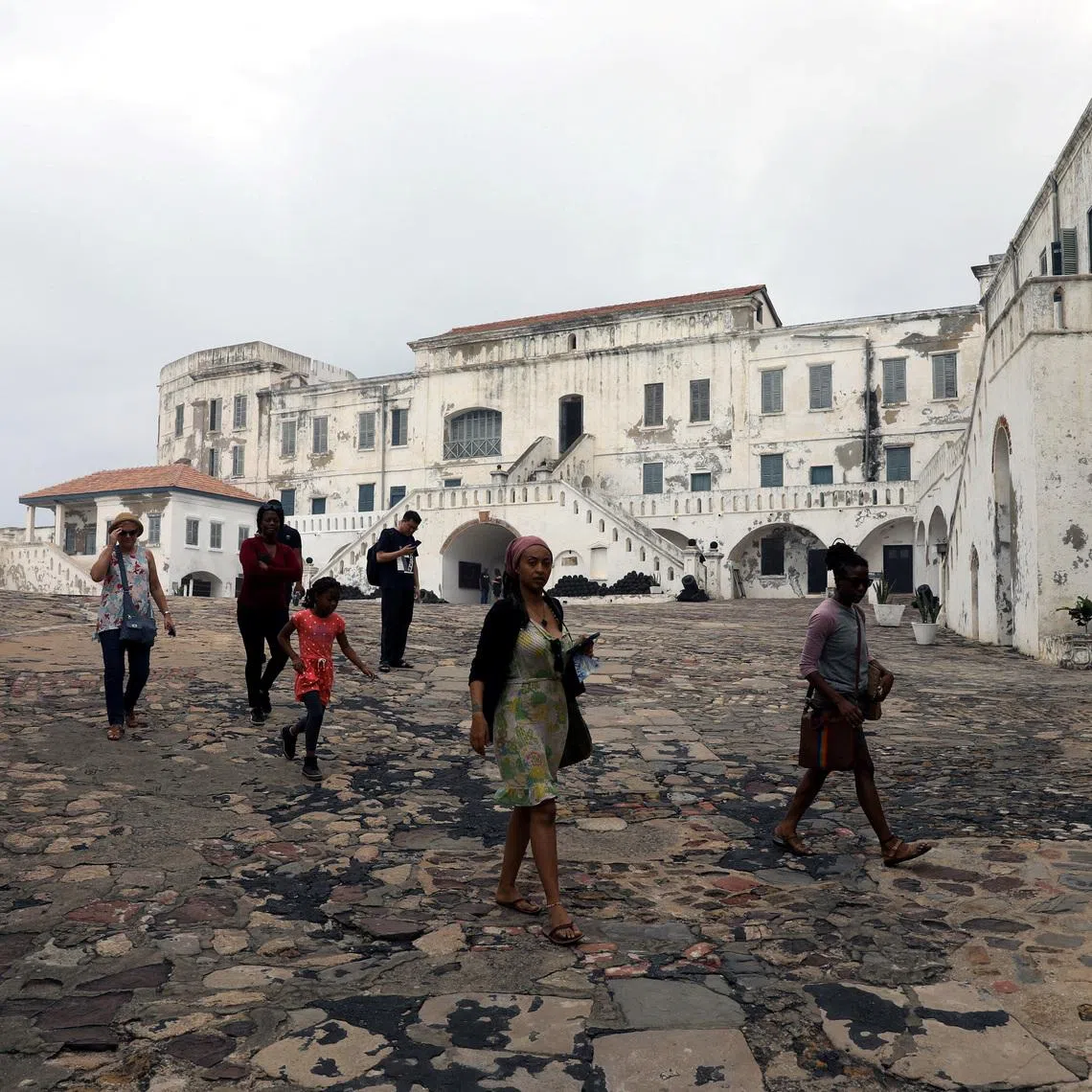 FILE PHOTO: Tourists are seen at the Cape Coast Castle one of several slave forts build along the Gold Coast in Ghana, July 28, 2019. Picture taken July 28,2019. REUTERS/Siphiwe Sibeko/File Photo