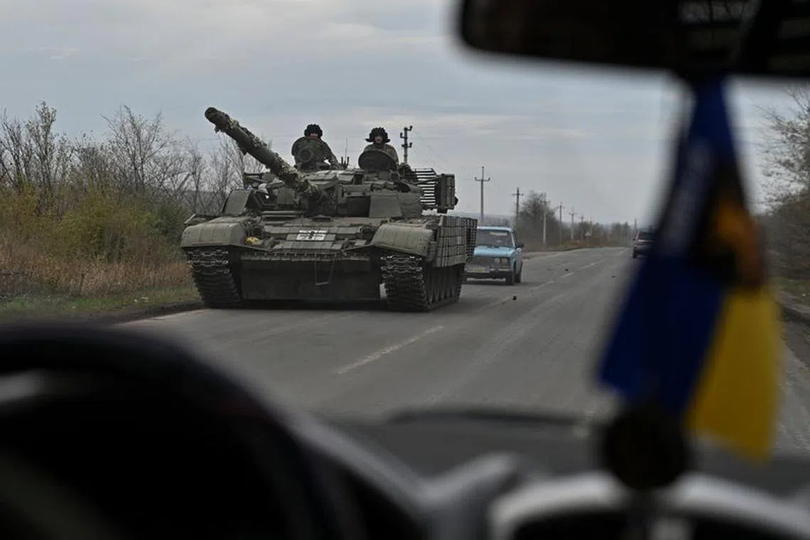 FILE PHOTO: Ukrainian servicemen ride in a tank along a road near a frontline, amid Russia's attack on Ukraine, in Zaporizhzhia region, Ukraine November 3, 2023. REUTERS/Stringer/File photo