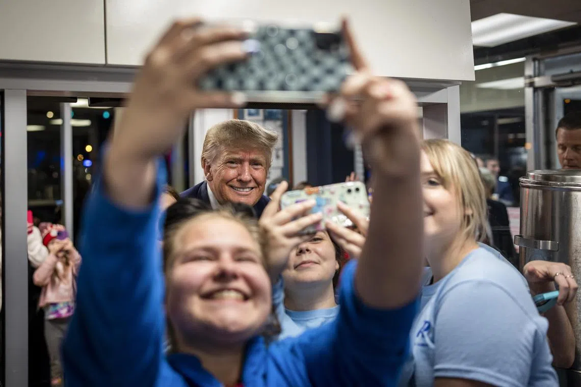 Former US President Donald Trump during a surprise stop at an ice cream and burgers shop in South Carolina last week. Trump spoke to about 200 people in the capitol building there, a contrast to the packed, raucous rallies he held in the past.